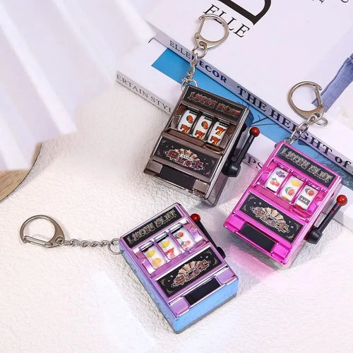 Cartoon Stress Reliever Keychains Coin Operated Games Mini Key Holder Toy Gambling Machine Kids Adult quixgadget
