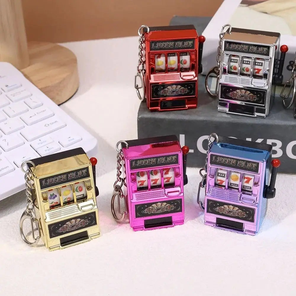 Cartoon Stress Reliever Keychains Coin Operated Games Mini Key Holder Toy Gambling Machine Kids Adult quixgadget
